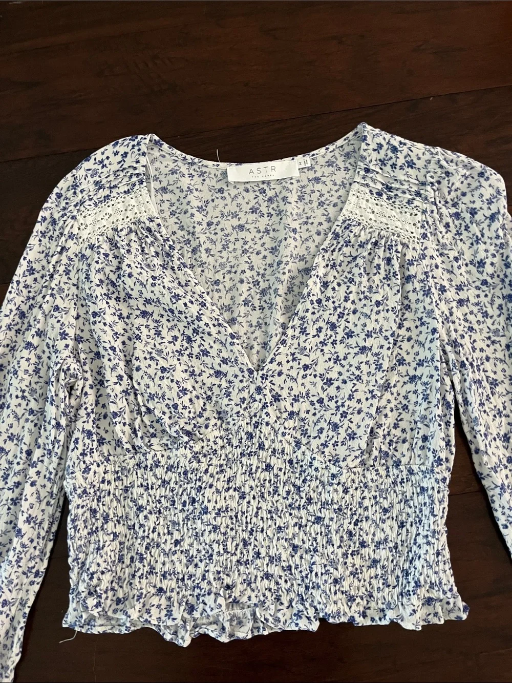 Astr Floral Long-Sleeve Smocked Crop Top in White and Blue